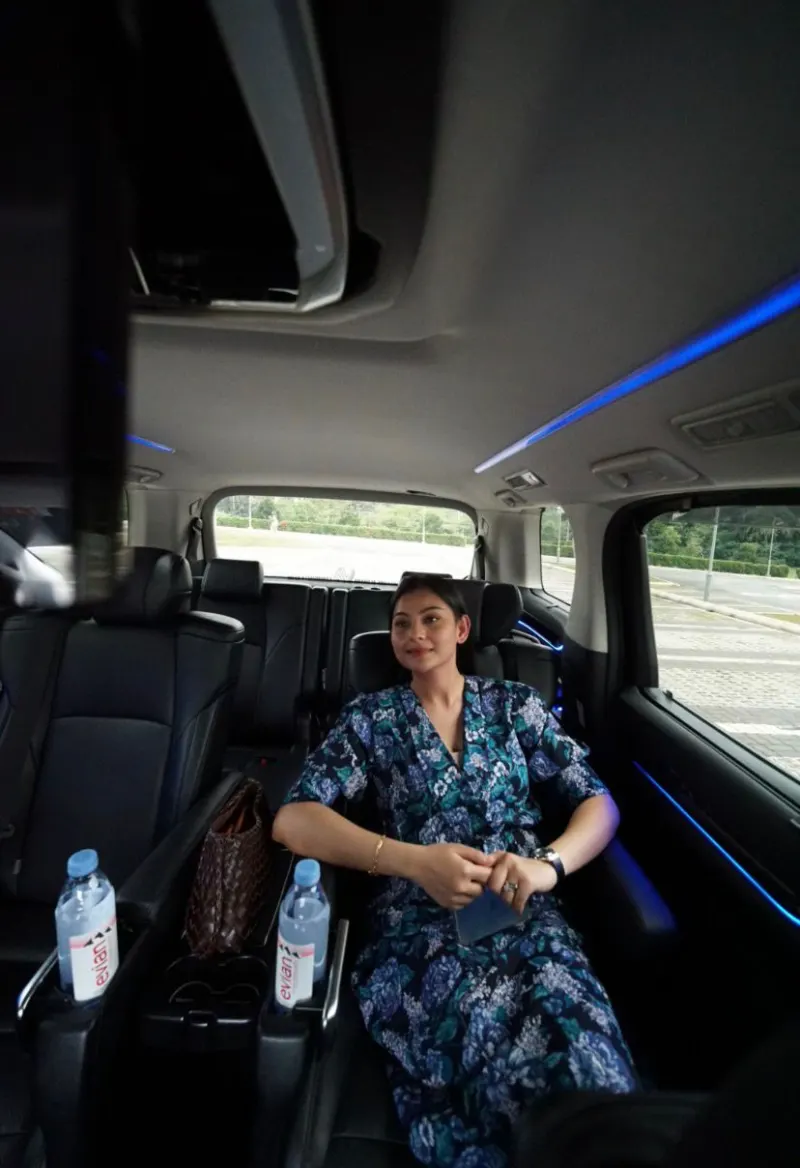 VIP client relaxing in Toyota Alphard luxury captain seat