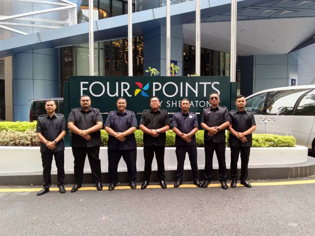 Seven JeyRey drivers in formal black uniform at Four Points Sheraton