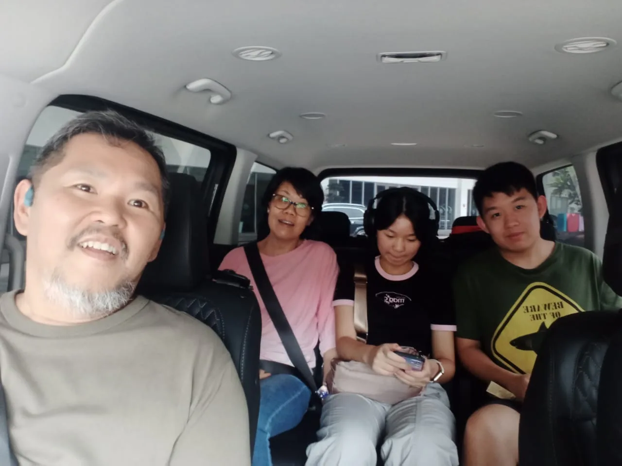 Family of four in van on outstation journey