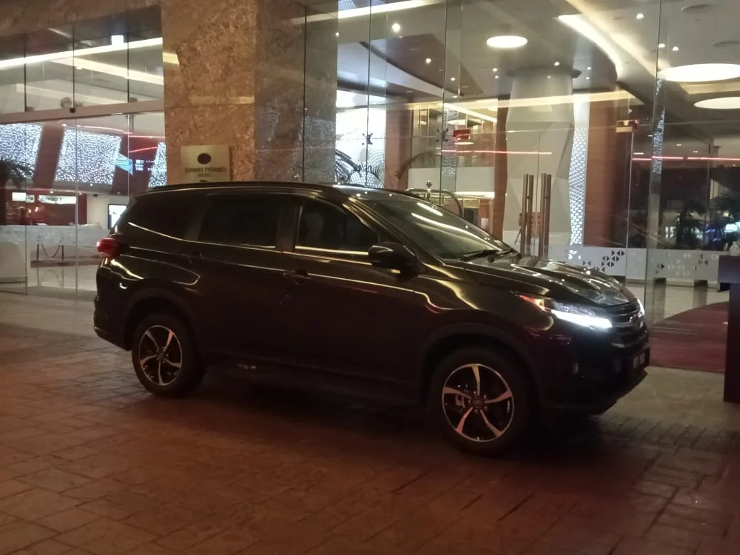 Group of four friends in vehicle after night out