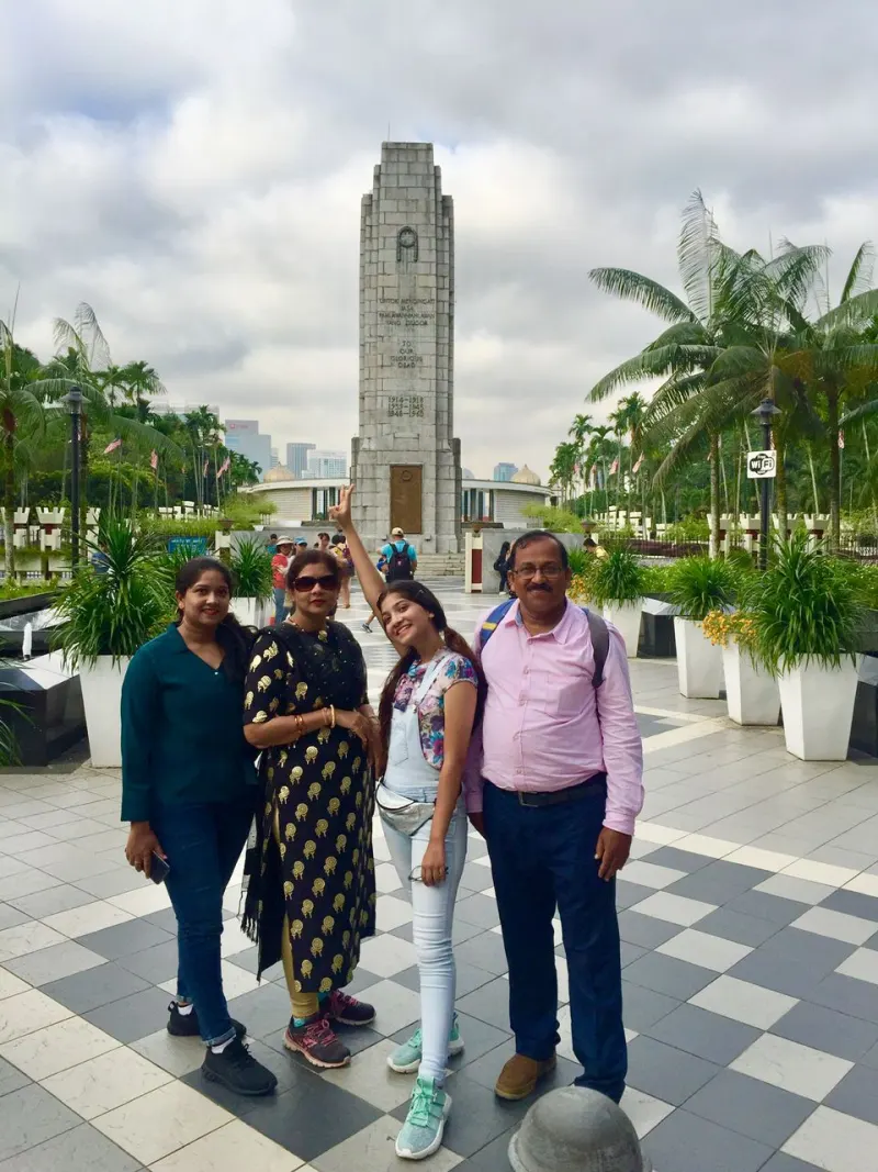 Family at Tugu Negara National Monument in Kuala Lumpur