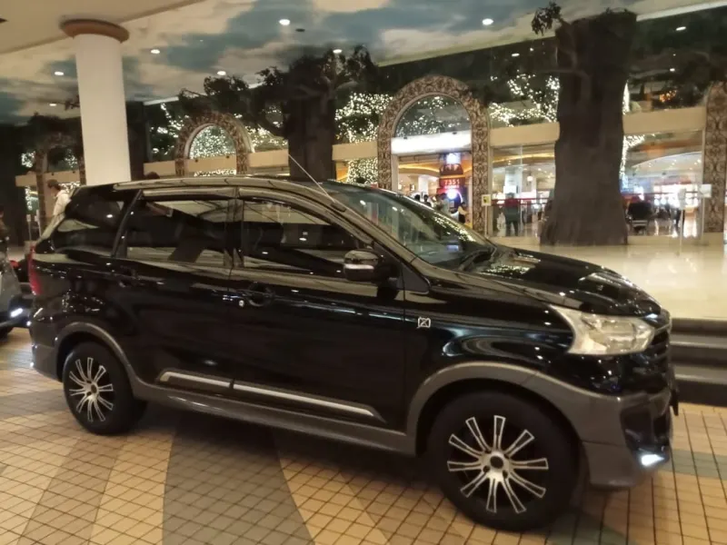 Multiple suitcases with airline tags loaded in MPV for KLIA pickup