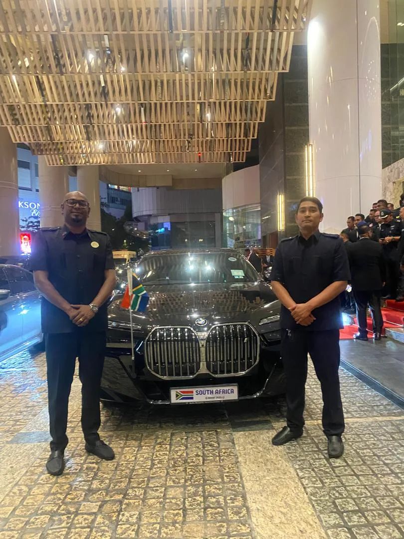 VIP BMW 7-Series with diplomatic flag and two uniformed JeyRey drivers